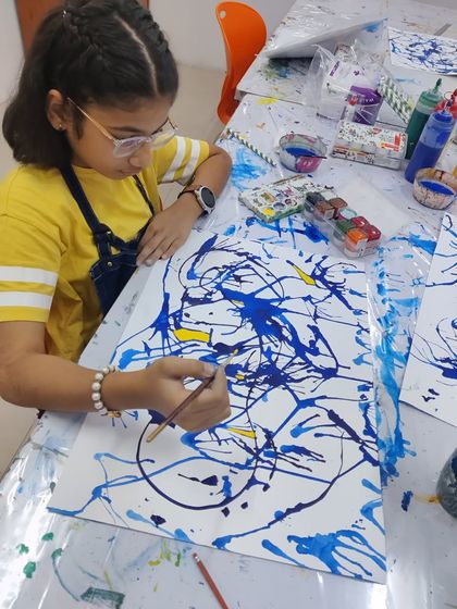 Glimpses from our summer camp, where students explore different techniques like dot painting and abstract art.