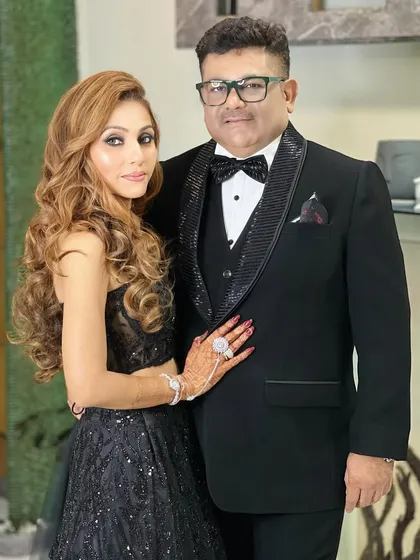 A classic portrait of the couple, looking sharp and glamorous in their black-tie attire.