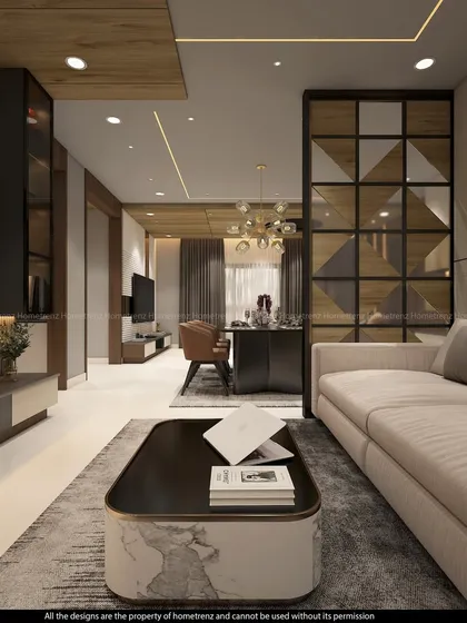 This living area uses a mirrored and wood-paneled partition to separate the dining space. The design is both functional and highly decorative, adding a touch of glamour to the room.
