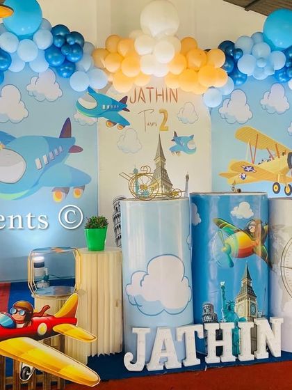 Another shot of the 'Flying High' airplane theme, showing the detailed props and balloon clouds.