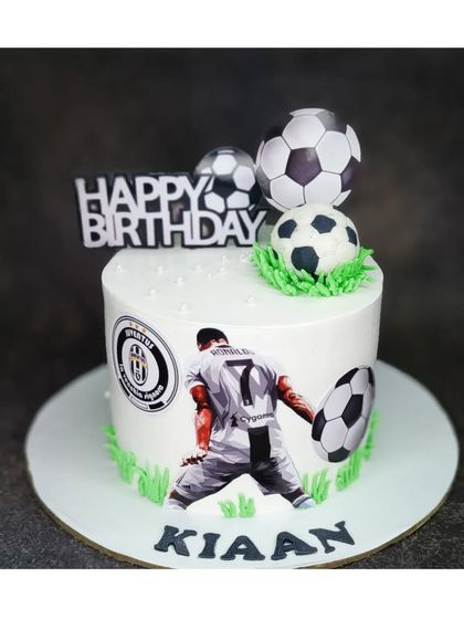 A Cristiano Ronaldo football cake for a fan. This eggless black forest cake features the football star and his team logo.
