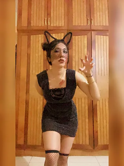 Getting into character as the black cat. I bring this same level of energy and commitment to any themed event you're planning.