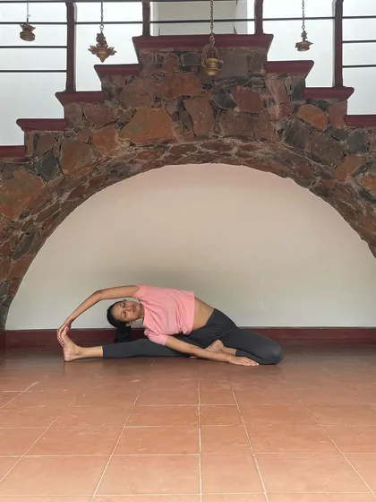 This side-bending stretch, a variation of Parivrtta Janu Sirsasana, targets the sides of the torso, the shoulders, and the hamstrings all at once. It's a wonderful pose for creating space in the body and improving spinal flexibility.