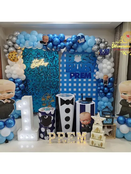 We brought the popular 'Boss Baby' to life for a first birthday with this fun setup. It includes character cutouts, a custom backdrop, and themed plinths, all in a classic blue and silver color scheme.
