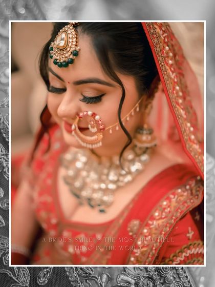 A beautiful close-up 얼굴 of Ishita, her soft smile and the delicate overlay creating a romantic and timeless bridal portrait.