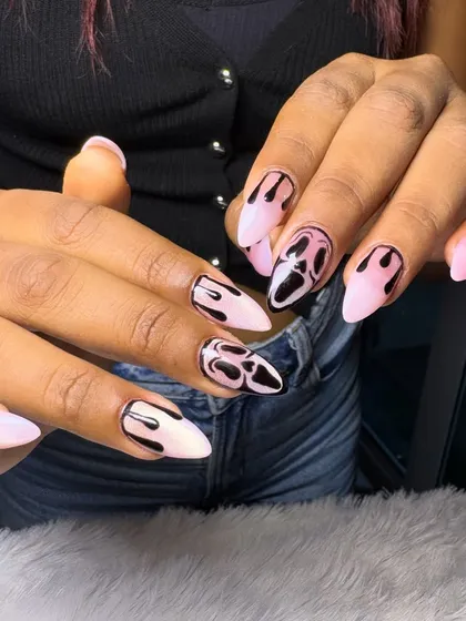 For our clients who love a bold and edgy look, we created this 'Scream' inspired nail art. This set features a matte pink base with glossy black graphic details, showcasing our skill in custom, pop-culture-themed designs.