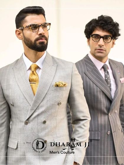 Two examples of perfectly tailored double-breasted suits. On the left, a light grey suit with a gold tie, and on the right, a pinstripe suit, showcasing classic and timeless menswear.