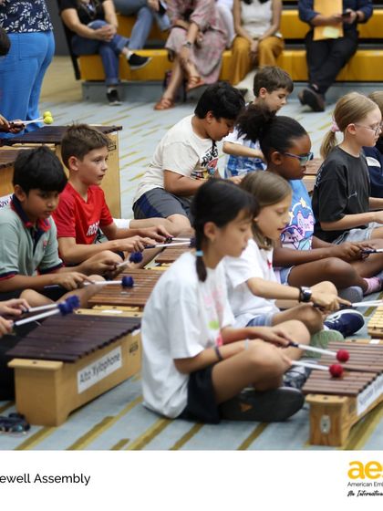 Students perform on xylophones during the Elementary School Farewell Assembly. Music and performance are woven into our celebrations, giving students a chance to share their talents and mark the occasion with joy.