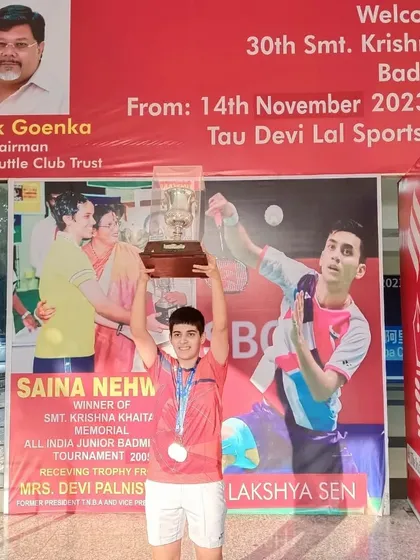 **Double Gold at Krishna Khaitan Memorial.** Anmol Kharb holding the trophies for her double victory in both Girls' Singles and Girls' Doubles U-19 at the prestigious All India Junior Ranking Tournament in Panchkula.