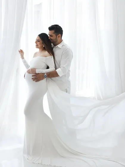 Your partner is a huge part of this journey, and capturing your connection is pure magic. This moment, with the light wrapping around you both in flowing white, is about the shared dream you're building together.