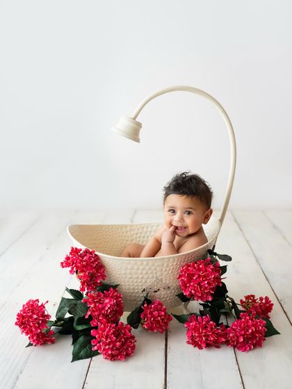 A sweet, shy smile from the tub. This prop is one of my favorites for sitter sessions, with or without water.