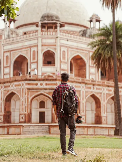 A shot of me with my backpack and camera, ready to explore Humayun's Tomb in Delhi. This is my typical setup for a day of shooting in the city.