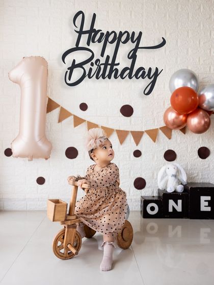 A candid moment of the birthday girl looking off to the side, creating a natural and thoughtful portrait.