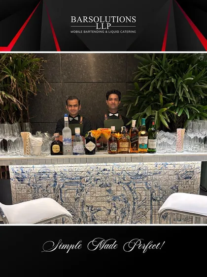 A stylish mobile bar setup for an exclusive house party, complete with elegant glassware and a well-stocked bar.