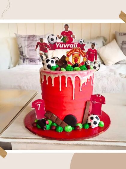 A vibrant red Manchester United football-themed cake with a drip effect, perfect for a dedicated fan.