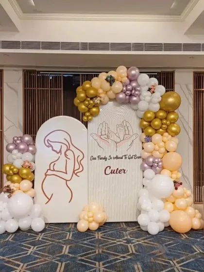 For this baby shower, I created an elegant and modern backdrop using arched panels and a custom organic balloon garland. The soft colors and clean lines are perfect for a sophisticated celebration for the mom-to-be.