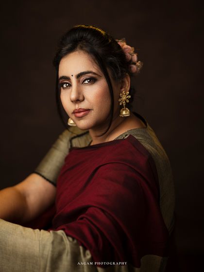 Elegance in stillness. This close-up portrait in a traditional saree, with flowers in her hair, is rich with cultural beauty and personal grace.