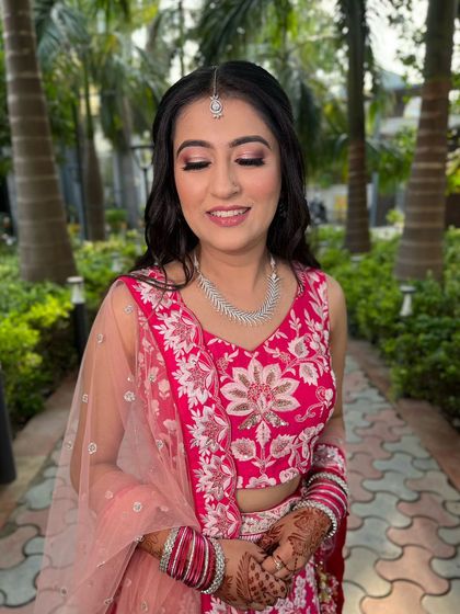 A close up of this bride's engagement makeup. The soft pink eyeshadow and glowing skin create a fresh and youthful look, perfect for a morning or daytime event.