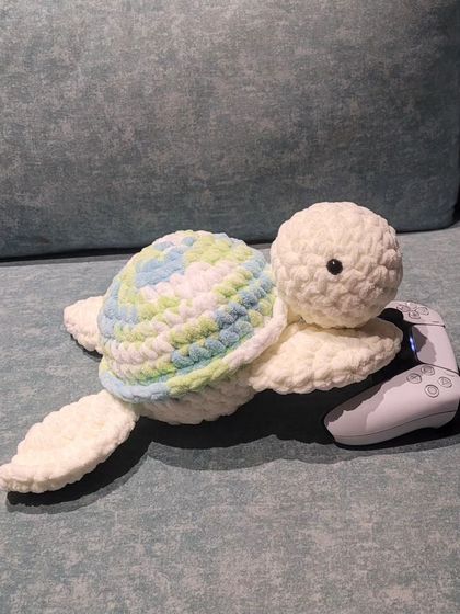 This turtle, with its cool-toned green and blue shell, is ready for game time. It shows a version without any blush or lashes for a simpler, classic look. You can decide on all these little details.