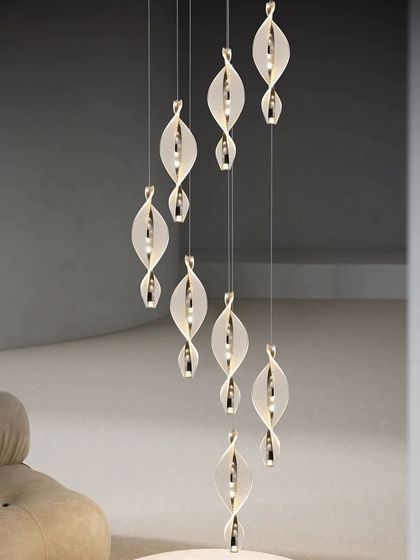 A beautiful installation of spiral pendants in a high-ceiling space, creating a sense of movement and wonder.