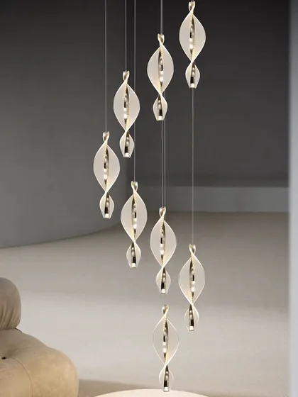 A beautiful installation of spiral pendants in a high-ceiling space, creating a sense of movement and wonder.