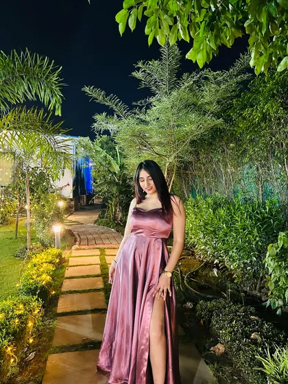 Another angle of the stunning gown, highlighting the thigh-high slit. This shows off the modern design details of the dress.