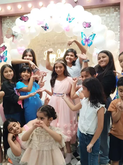 The birthday girl, Avisha, surrounded by all her friends. I make sure there are plenty of great photo opportunities like this one with our butterfly-themed balloon arch.