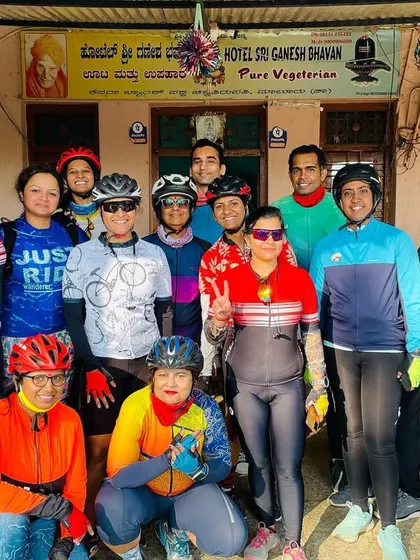 The whole crew after a rewarding ride. This group photo captures the diversity of our members and the different generations of SpokesWomen jerseys worn with pride.