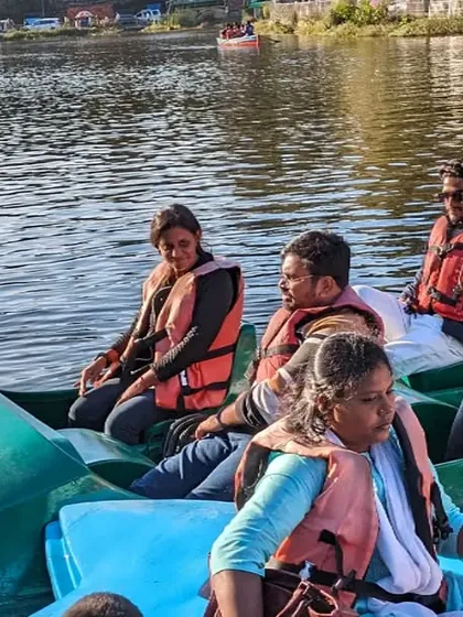 A candid shot of trekkers enjoying a boat ride on the lake.