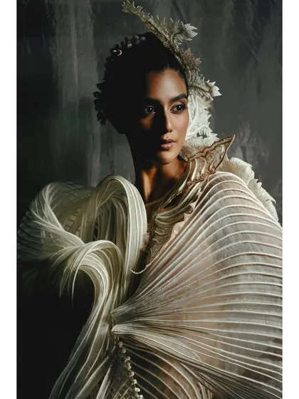A close-up on a white, heavily textured Vaishali S. piece. My lighting strategy here was to use shadows to carve out the details, making the fabric's complex, sculptural quality tangible.
