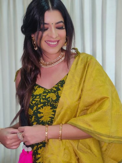 Another candid from my Lohri celebration look. The yellow and green outfit is beautifully complemented by the warm tones in the makeup.