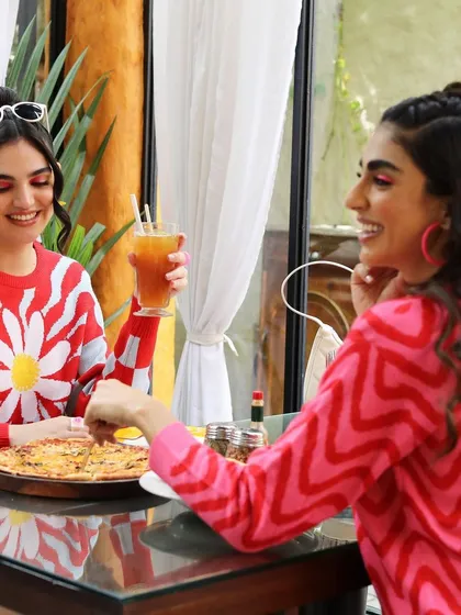 A candid-style lifestyle shot for a campaign. I styled these two models in colorful, retro-inspired sweaters for a casual brunch scene, creating a relatable and friendly vibe.
