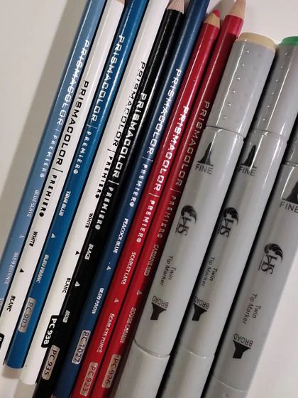 A flat lay of the Prismacolor pencils and Copic markers I used for the ice cream drawing.