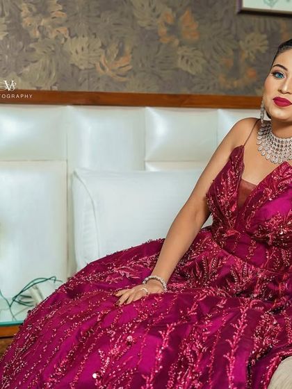A chic and confident portrait of the bride on her engagement day, posing elegantly in her hotel room.
