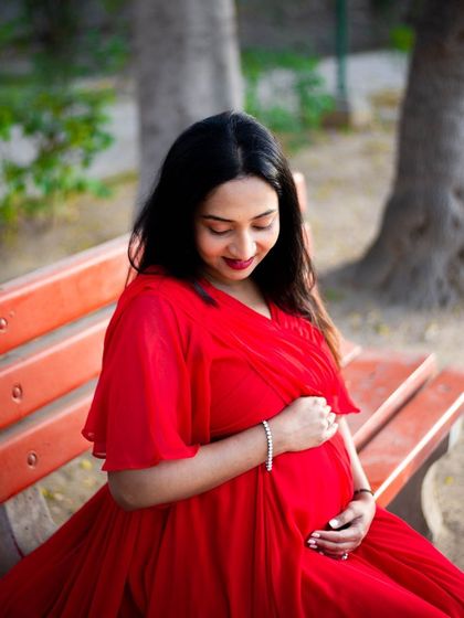 A quiet moment on a park bench allows for a simple, elegant portrait. Her gaze towards her bump is full of love and connection, a feeling I always strive to capture during a solo maternity session.
