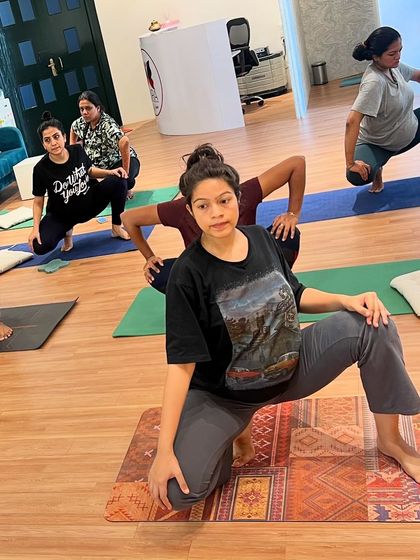 A glimpse into our Monday class. Here, our moms are in a lunge variation, a great pose for opening the hips and building leg strength in preparation for labor.