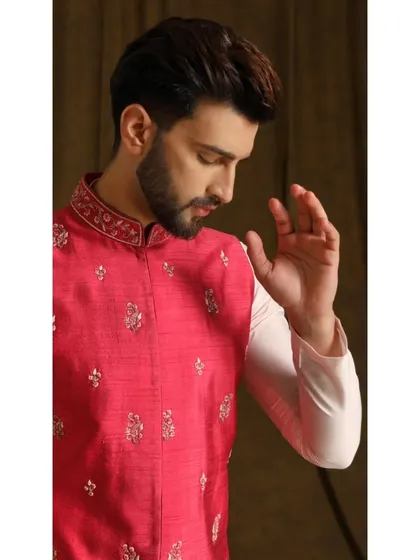 The Gulab Dev bandi set. A radiant pink embroidered vest makes a charming and elegant statement, perfect for daytime festivities.