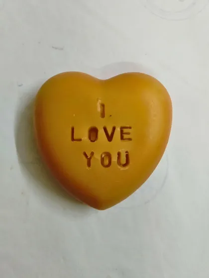 A heart-shaped soap stamped with 'I LOVE YOU'. A simple, thoughtful way to show you care.