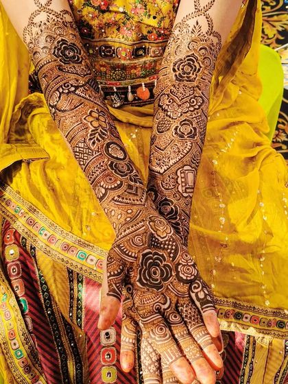 The beautiful mehndi for bride Saba, captured from different angles. The design includes personalized initials and a rich, dark stain.