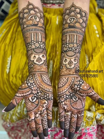 This full-hand design showcases a blend of traditional motifs, including intricate peacock figures and detailed jaali patterns, all done with my natural henna for a rich stain.