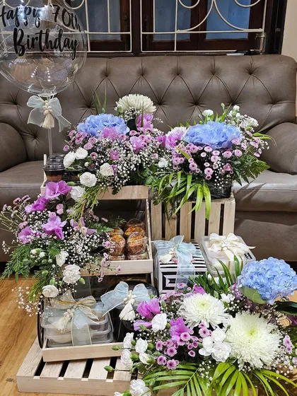 Celebrating a 70th birthday calls for something truly grand. I curated this spectacular arrangement with tiers of delicious treats, lush floral displays, and personalized touches to honor such a special milestone in the most beautiful way.