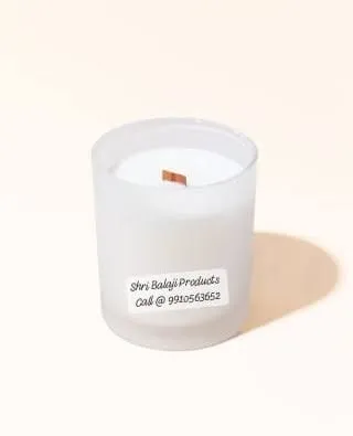 A finished candle made with one of my wooden wicks, placed in a frosted glass jar. This creates a modern and cozy aesthetic that is very popular.