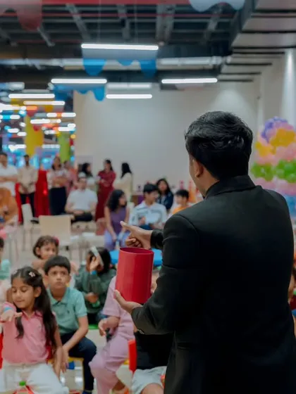 Performing in a vibrant kids' play area. My shows are adaptable to any space, whether it's a formal stage or a casual party setting. The focus is always on engaging the children directly.