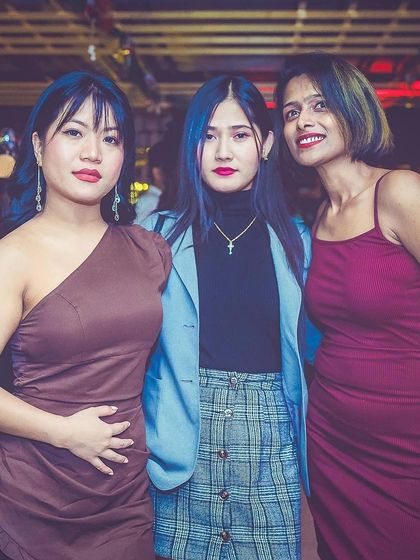 A group of stylishly dressed guests.