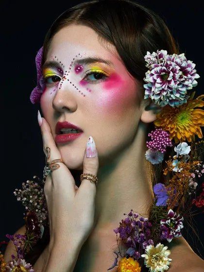A stunning high-floral shoot from our Delhi batch, featuring intricate, colorful makeup and beautiful flower arrangements.