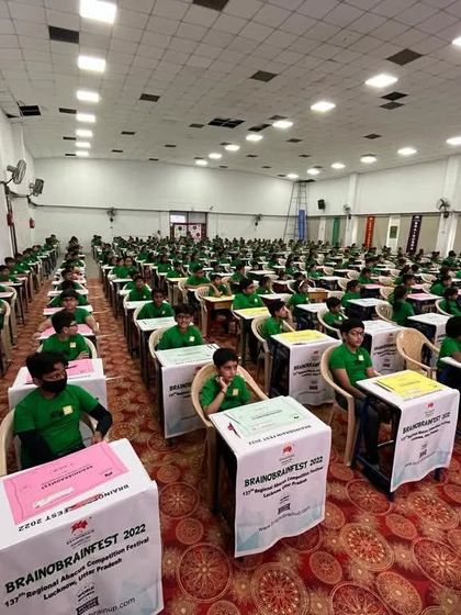 Rows of our young geniuses, focused and ready for the competition to begin. This image captures the discipline and concentration our program instills in children.