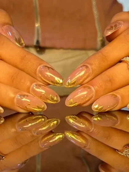 A luxurious design with a sheer nude base and abstract gold foil accents, creating a rich, artistic look.