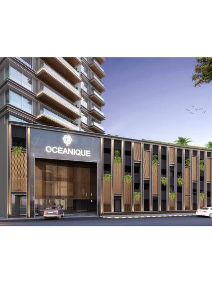 The entrance to the "Oceanique" residential tower, where a carefully designed podium level integrates greenery and modern materials. This project is conceived as an urban oasis that offers residents both style and tranquility.