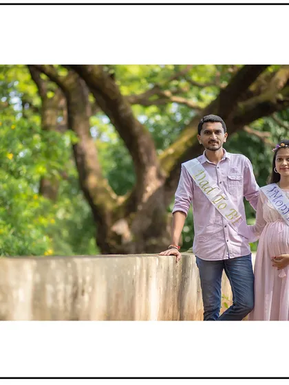 A proud stance from the parents-to-be, wearing their sashes and ready for their new adventure.