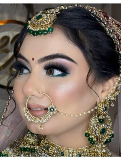 A detailed close-up of our bridal makeup. Notice the precision of the winged liner, the flawless skin finish, and the way the makeup enhances her features, making her eyes the star of the show.